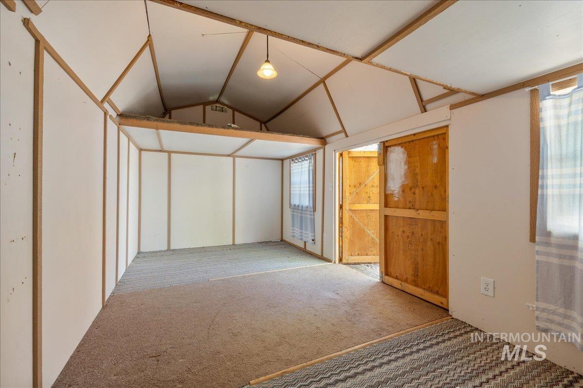 3002 Frozen Dog Road Emmett, ID 83617 - Photo 41 of 50 Unfurnished bedroom featuring vaulted ceiling and carpet