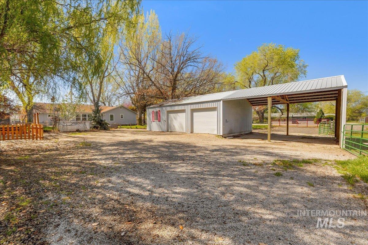 3002 Frozen Dog Road Emmett, ID 83617 - Photo 42 of 50 View of yard featuring an outdoor structure and a garage