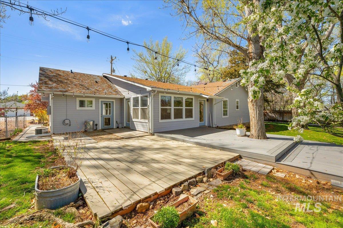3002 Frozen Dog Road Emmett, ID 83617 - Photo 5 of 50 Rear view of house with a wooden deck and a patio area