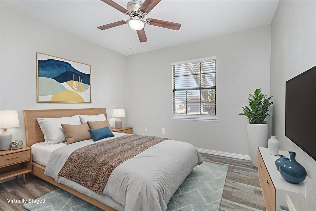 5513 Rearn Drive The Colony, TX 75056 - Photo 11 of 19 a bedroom with a bed and a window