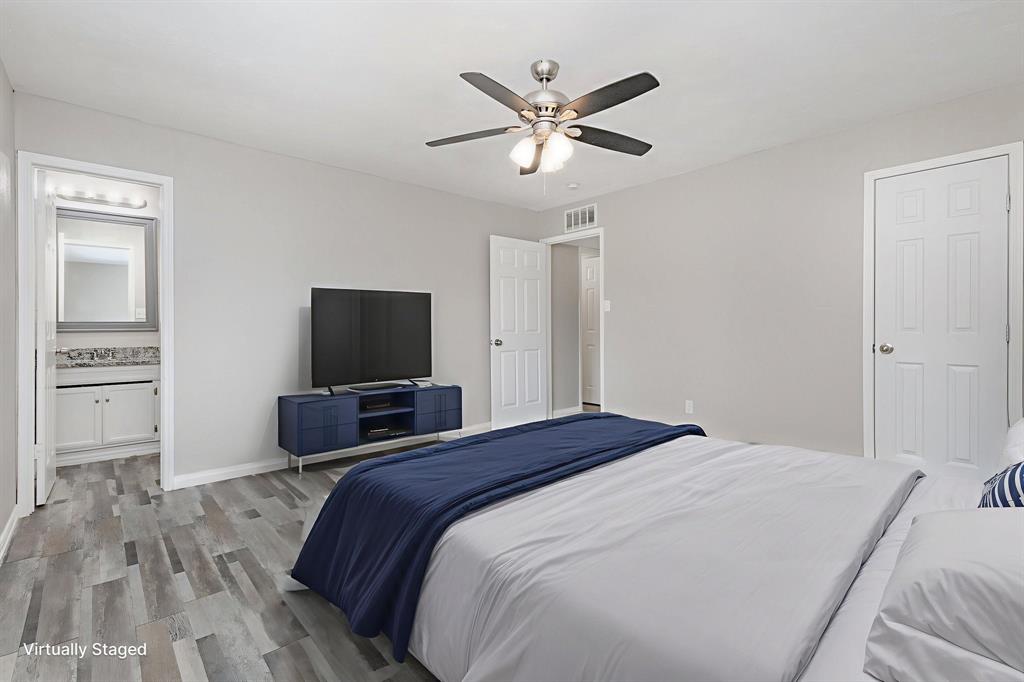 5513 Rearn Drive The Colony, TX 75056 - Photo 14 of 19 a bedroom with a bed and a flat screen tv