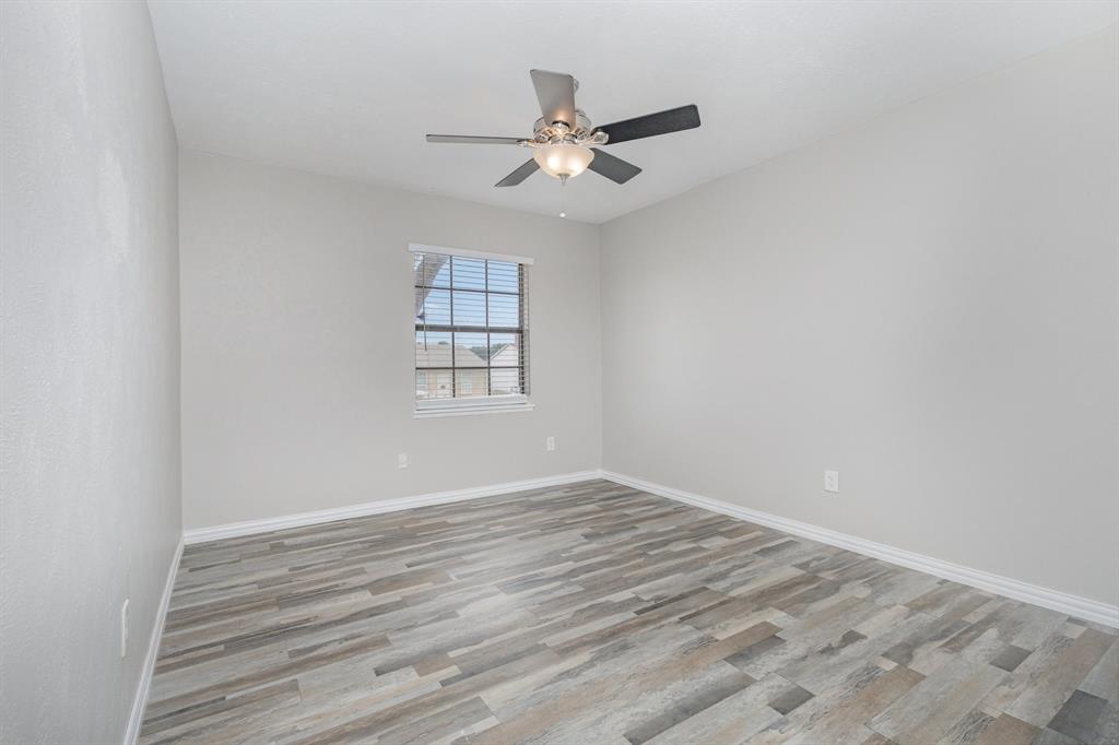 5513 Rearn Drive The Colony, TX 75056 - Photo 16 of 19 a view of a room with window and ceiling fan