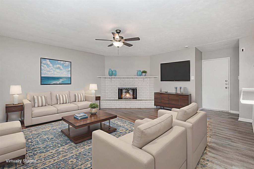 5513 Rearn Drive The Colony, TX 75056 - Photo 5 of 19 a living room with furniture a fireplace and a flat screen tv