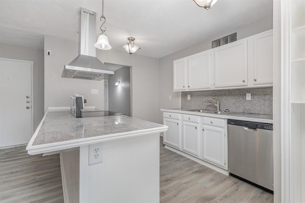 5513 Rearn Drive The Colony, TX 75056 - Photo 9 of 19 a kitchen with a sink dishwasher and cabinets