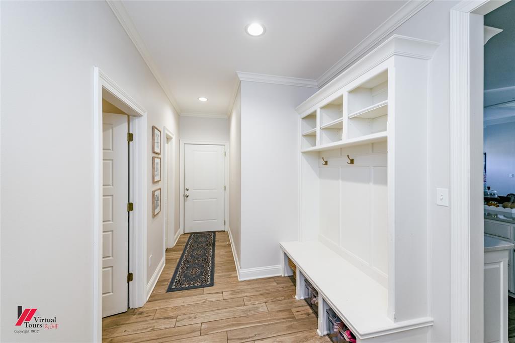 327 Ramsey Road Stonewall, LA 71078 - Photo 21 of 40 a view of a hallway with wooden floor and closet