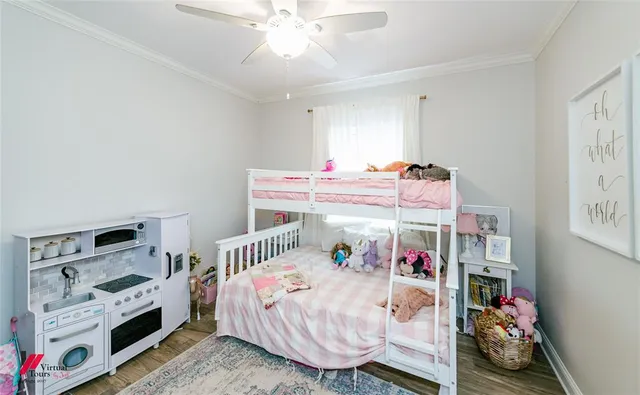 a bedroom with a bed and a white cabinet