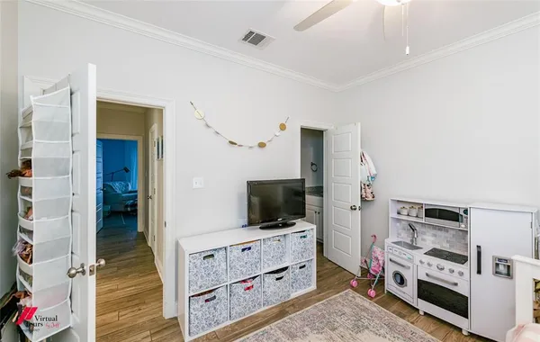 a room with furniture and flat screen tv