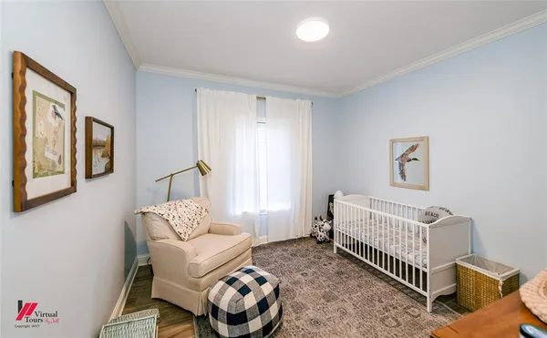 a bedroom with furniture and a window