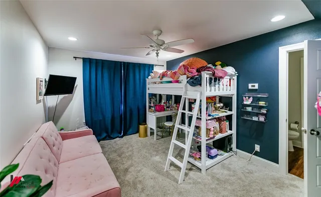 a bed room with a bed and a flat screen tv