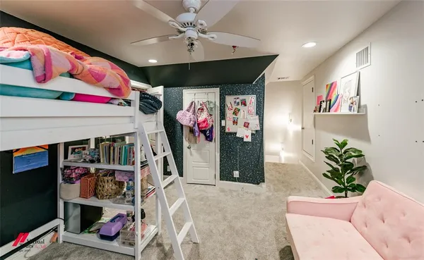 a living room with lots of storage and a white umbrella