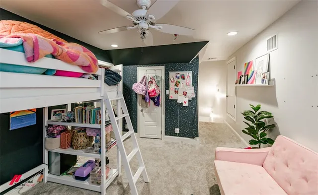 a living room with lots of storage and a white umbrella