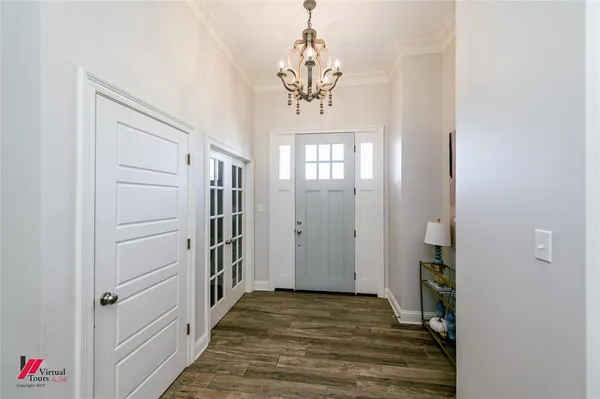 a view of a hallway view with wooden floor and staircase