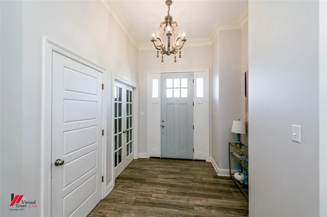 a view of a hallway view with wooden floor and staircase