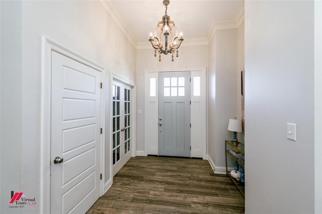 327 Ramsey Road Stonewall, LA 71078 - Photo 4 of 40 a view of a hallway view with wooden floor and staircase