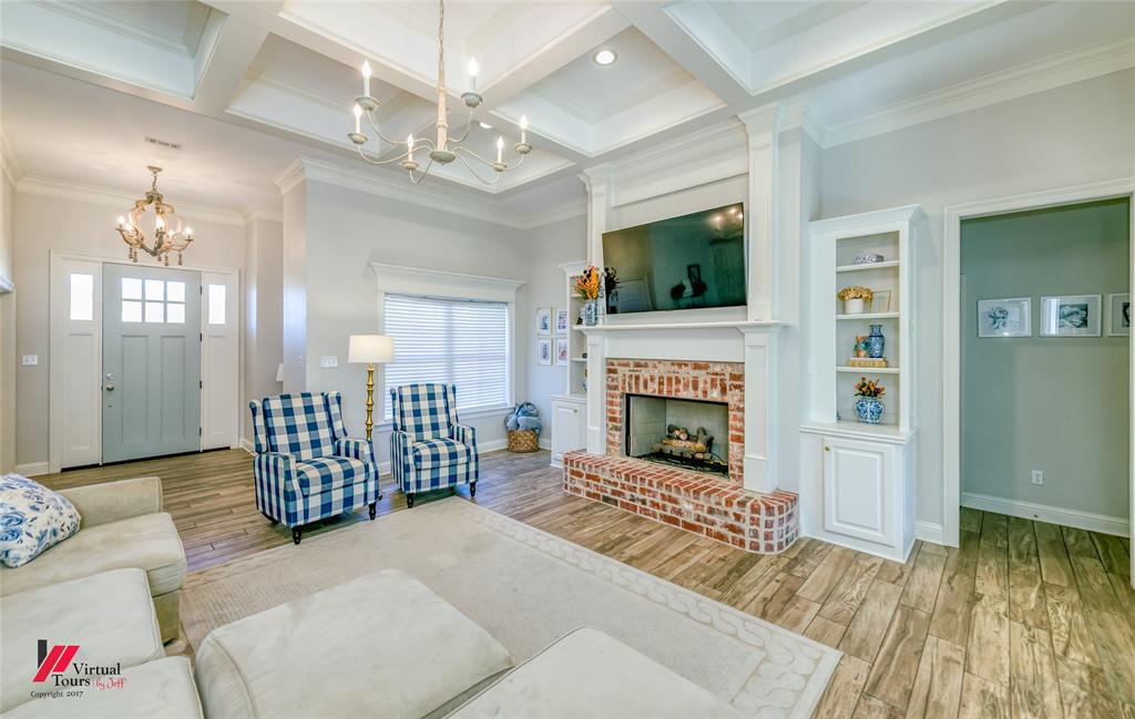 327 Ramsey Road Stonewall, LA 71078 - Photo 7 of 40 a living room with furniture and a fireplace