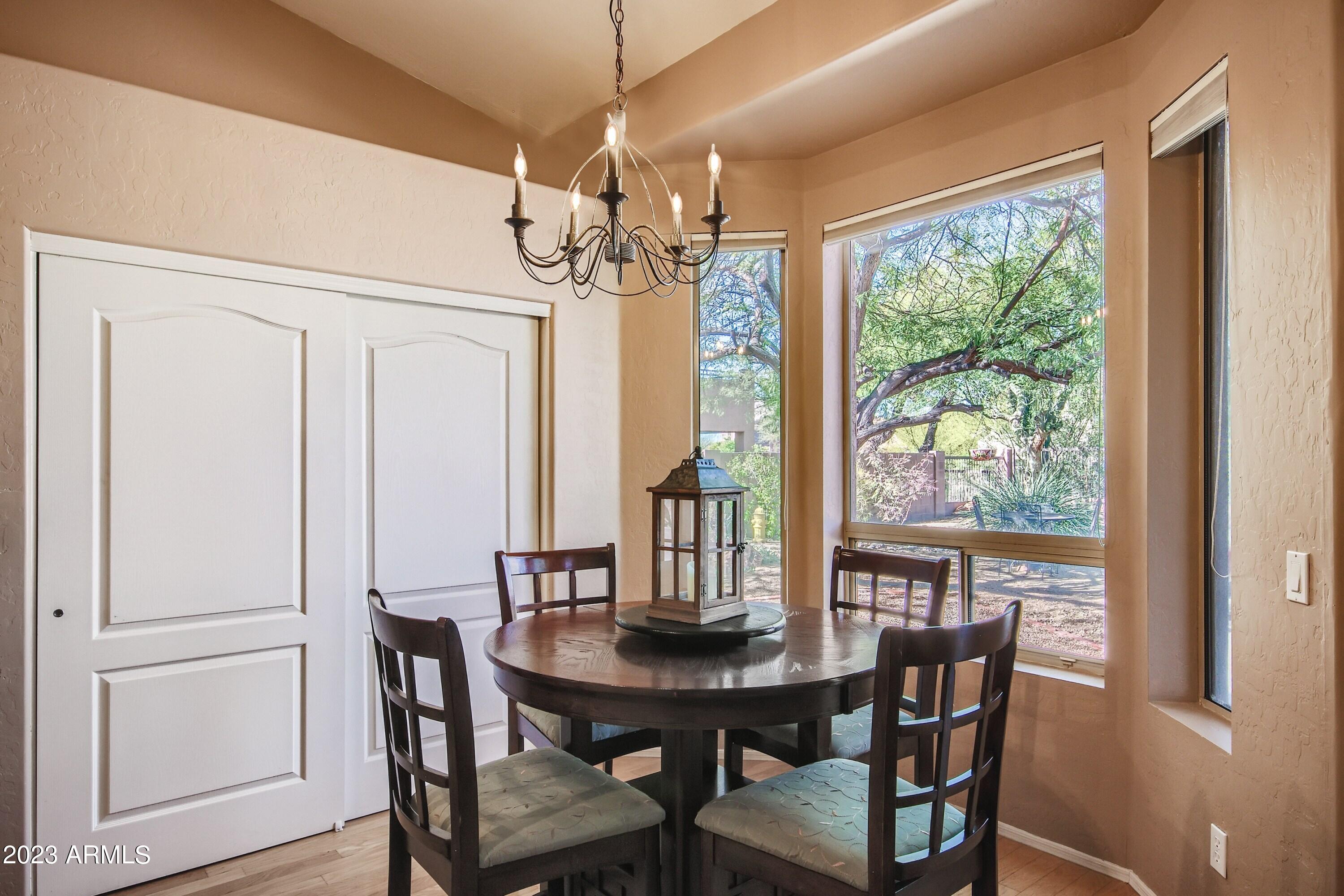 3060 North Ridgecrest, Unit 175 Mesa, AZ 85207 - Photo 11 of 28 a view of a dining room with furniture window and outside view