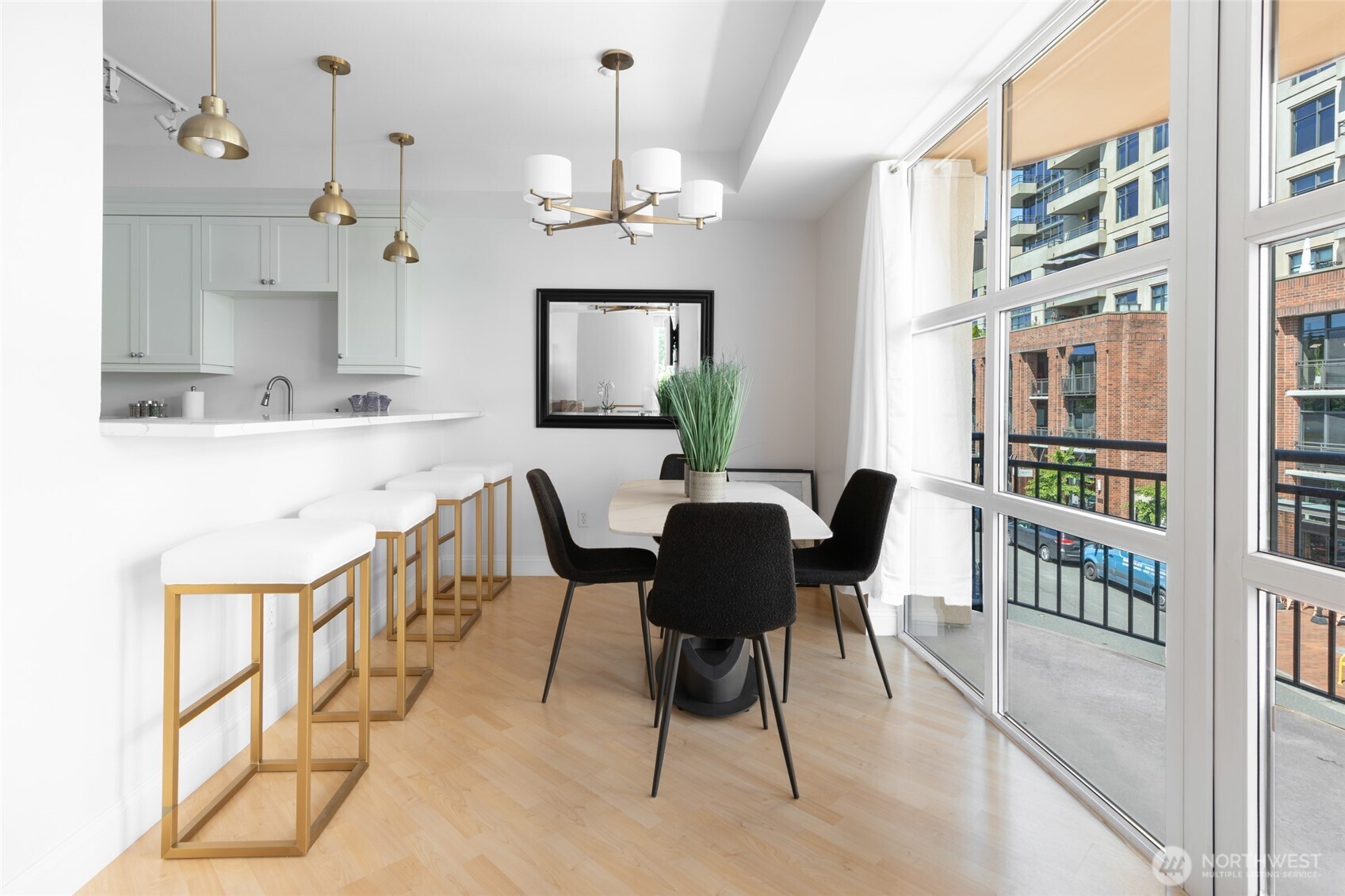 10047 Main Street, Unit 319 Bellevue, WA 98004 - Photo 11 of 30 a view of a dining room with furniture