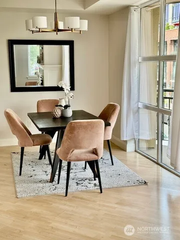 a view of a dining room with furniture and a window