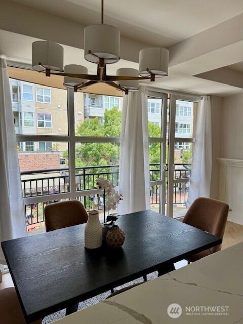 10047 Main Street, Unit 319 Bellevue, WA 98004 - Photo 14 of 30 a view of a dining room with furniture window and outside view