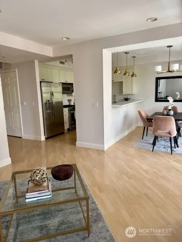 a living room with furniture and a rug