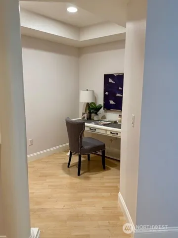 a workspace with furniture and wooden floor