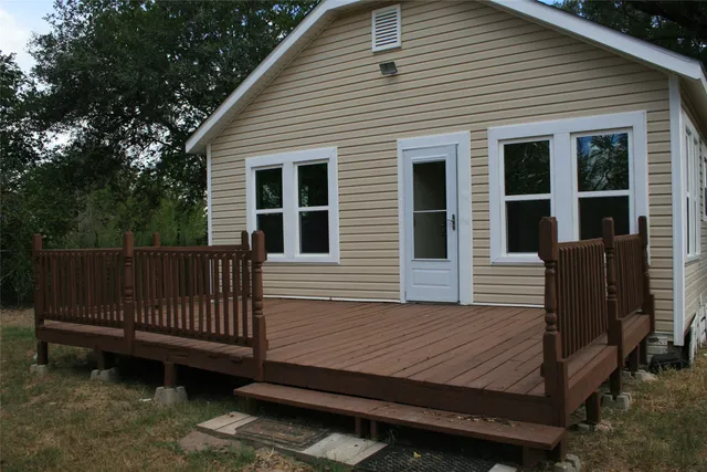 a view of a wooden bench in back yard