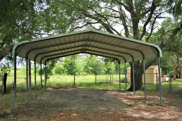 a view of backyard with green space