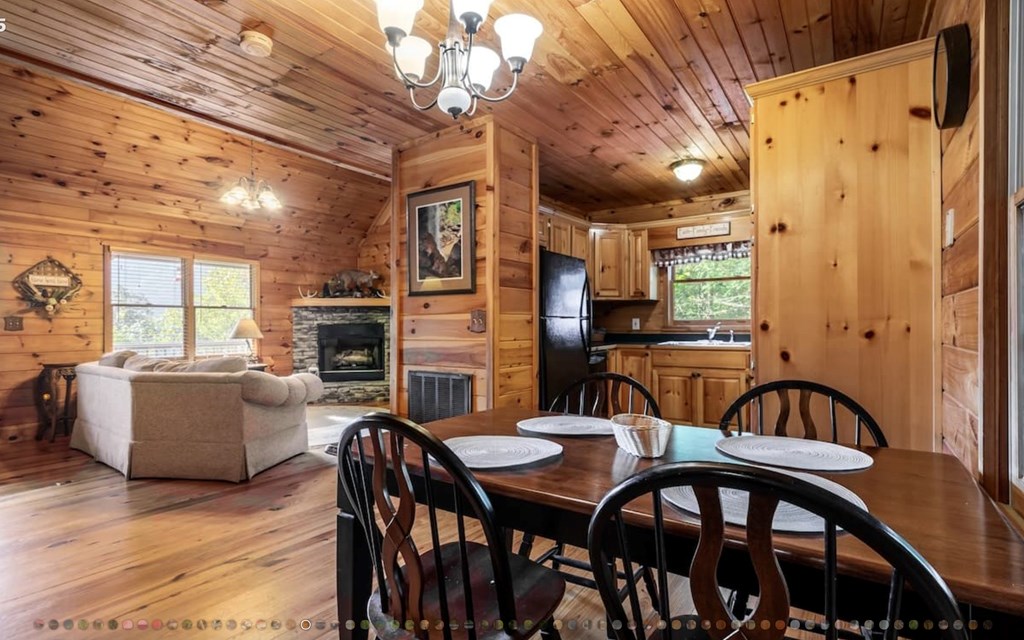 335 Mountain Laurel Lane Blue Ridge, GA 30513 - Photo 12 of 67 a view of a dining room with furniture window and wooden floor