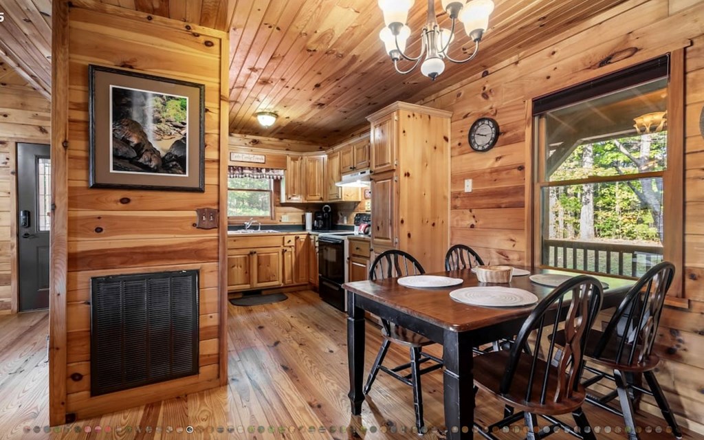 335 Mountain Laurel Lane Blue Ridge, GA 30513 - Photo 13 of 67 a view of a dining room with furniture window and outside view