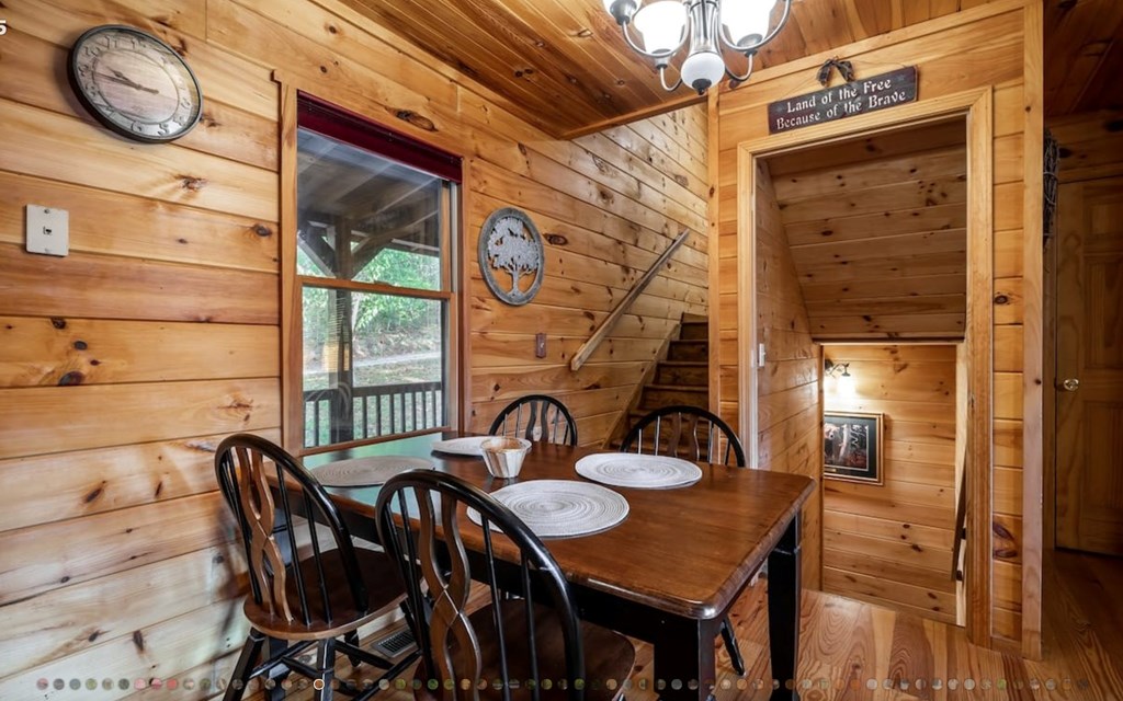 335 Mountain Laurel Lane Blue Ridge, GA 30513 - Photo 14 of 67 a dining room with furniture and wooden floor