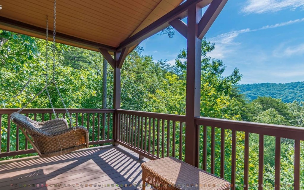 335 Mountain Laurel Lane Blue Ridge, GA 30513 - Photo 18 of 67 a view of a chair in wooden deck