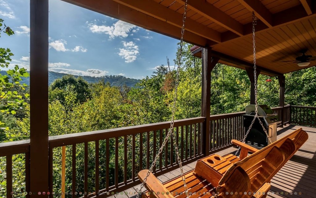 335 Mountain Laurel Lane Blue Ridge, GA 30513 - Photo 2 of 67 a view of balcony with furniture and umbrella