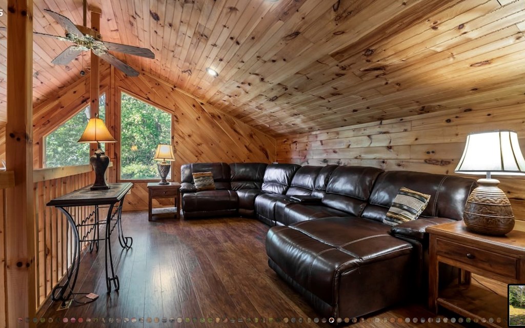 335 Mountain Laurel Lane Blue Ridge, GA 30513 - Photo 34 of 67 a living room with furniture a wooden floor and next to a window