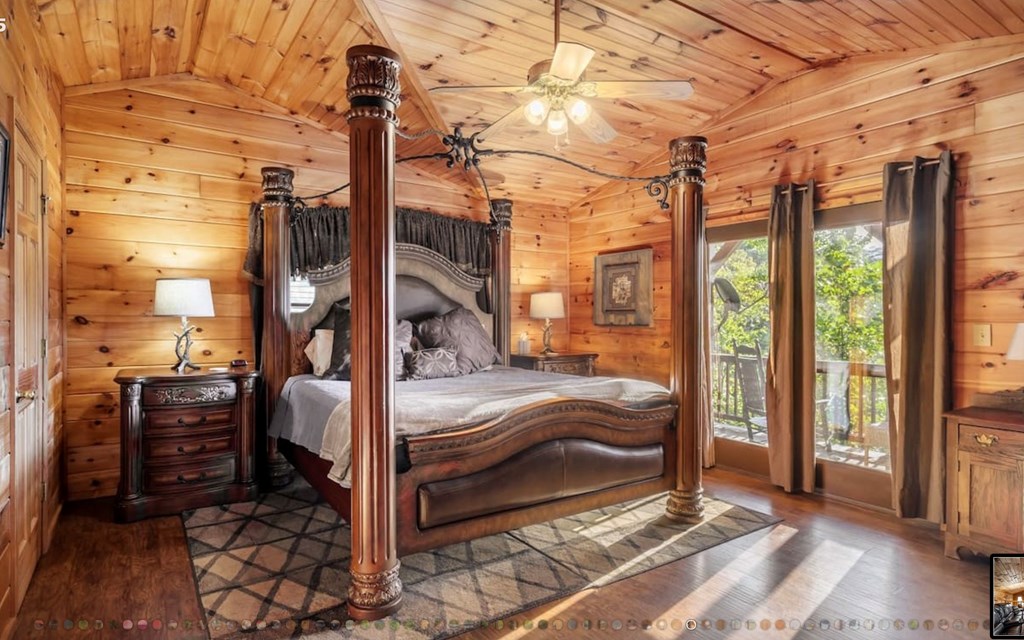 335 Mountain Laurel Lane Blue Ridge, GA 30513 - Photo 37 of 67 a view of a bedroom with a bed and glass door