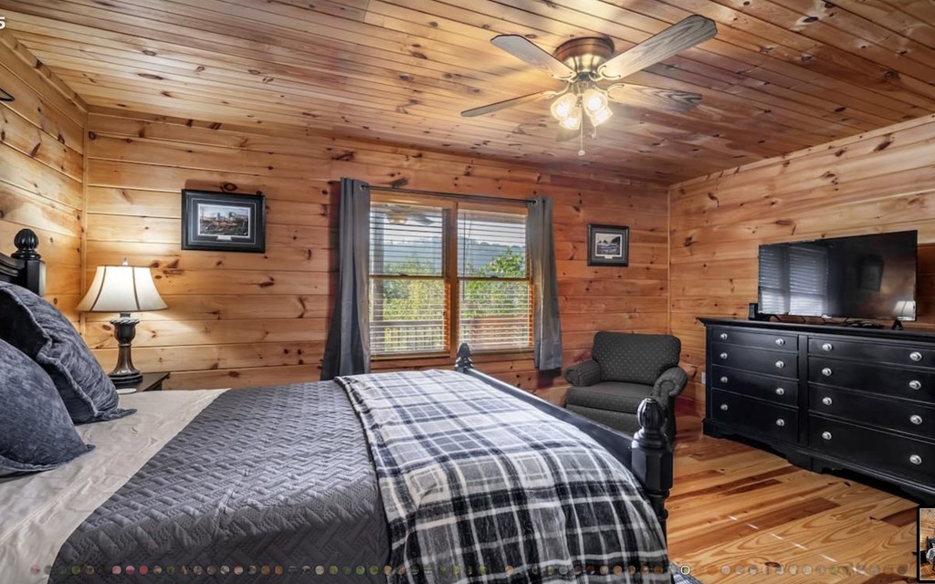 335 Mountain Laurel Lane Blue Ridge, GA 30513 - Photo 41 of 67 a bedroom with a bed and wooden floor