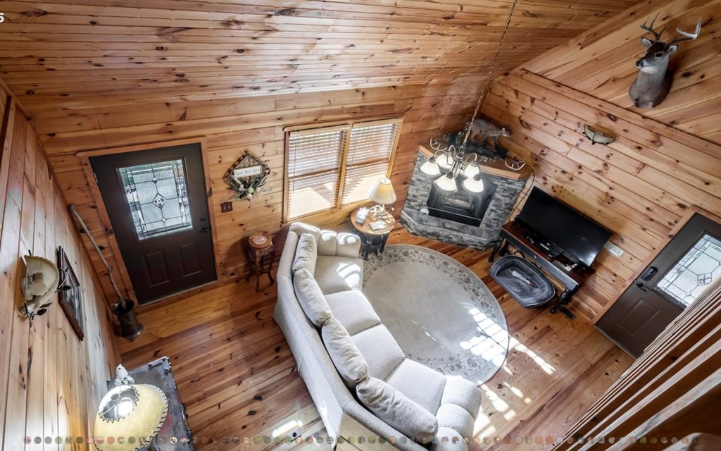 335 Mountain Laurel Lane Blue Ridge, GA 30513 - Photo 67 of 67 a living room with furniture fireplace and flat screen tv