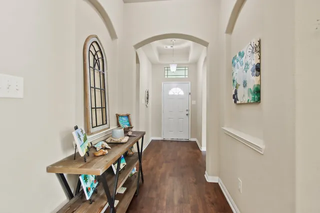 a view of a livingroom with furniture and wooden floor