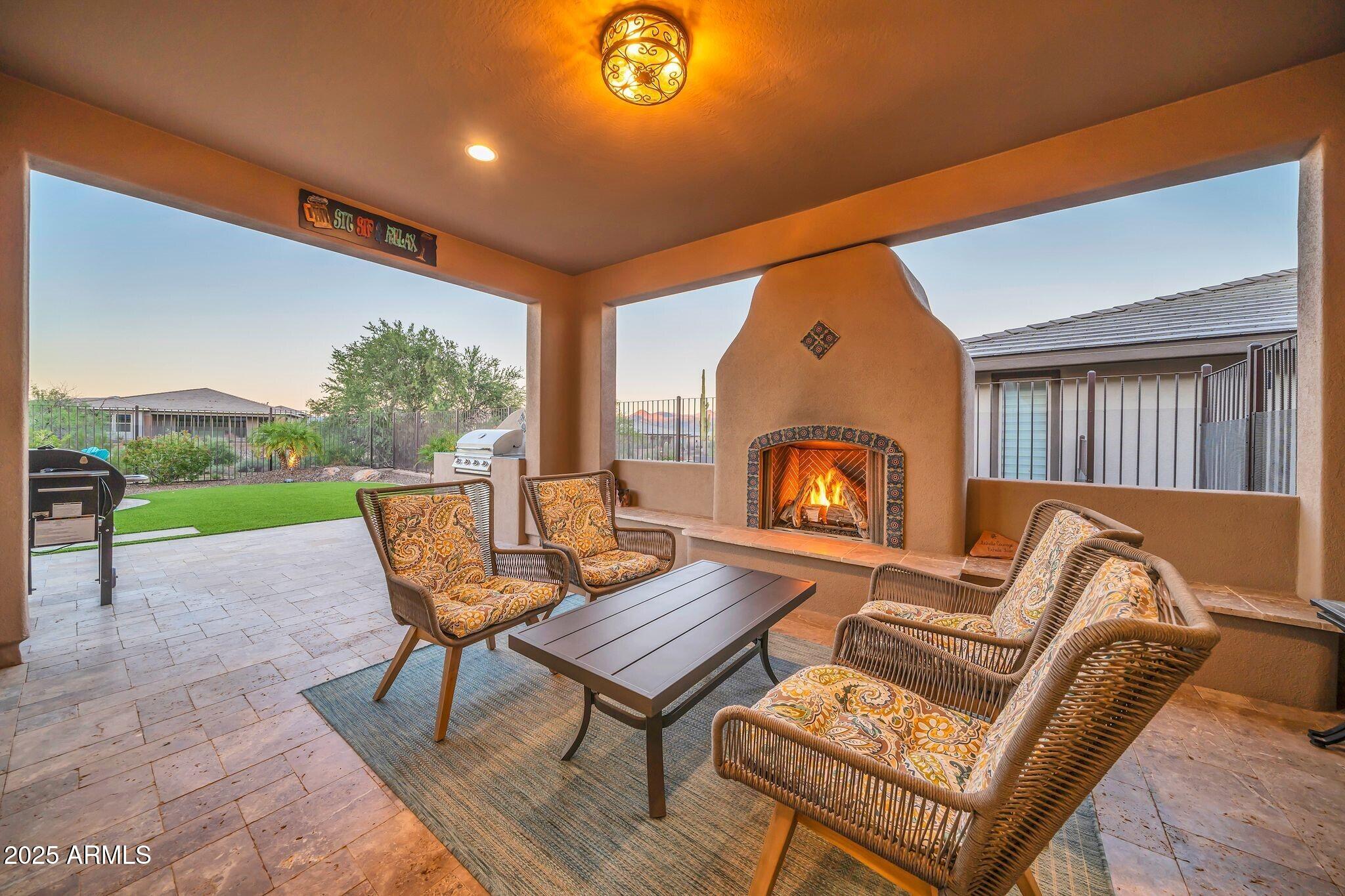 18212 East Parker Creek Road Rio Verde, AZ 85263 - Photo 24 of 47 a outdoor living space with furniture and a garden