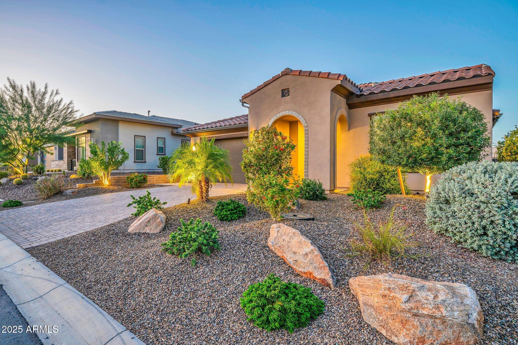 18212 East Parker Creek Road Rio Verde, AZ 85263 - Photo 5 of 47 a front view of a house with garden