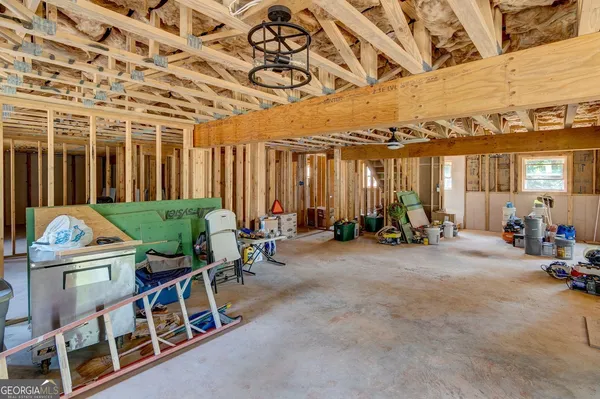 a living room with furniture fireplace and flat screen tv
