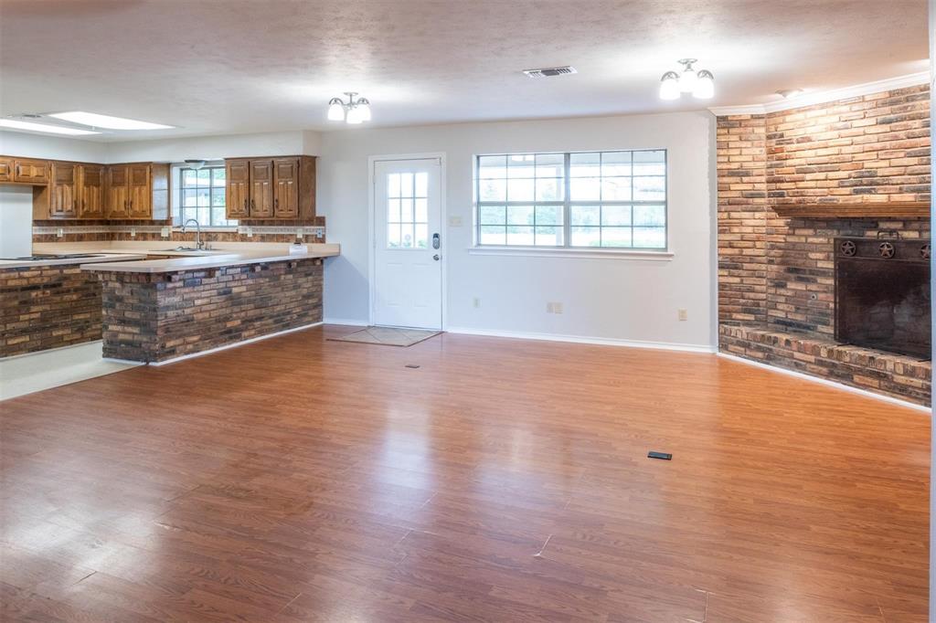 1850 Rock Ridge Road Lucas, TX 75002 - Photo 14 of 34 an empty room with wooden floor and windows