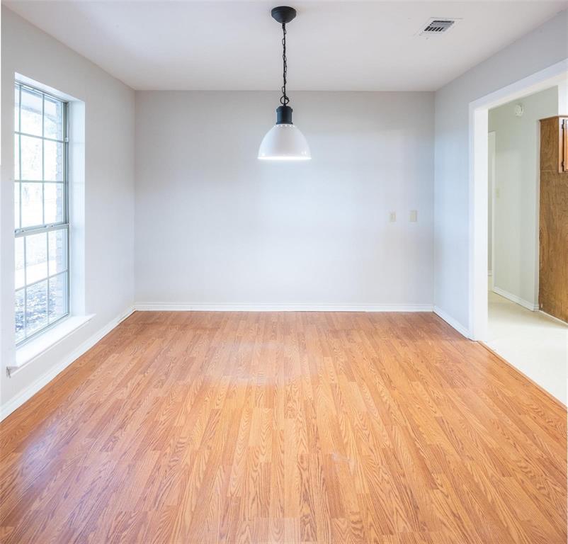 1850 Rock Ridge Road Lucas, TX 75002 - Photo 18 of 34 a big room with wooden floor windows and cabinet