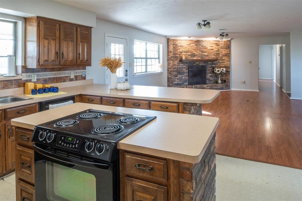 1850 Rock Ridge Road Lucas, TX 75002 - Photo 31 of 34 a kitchen with a stove a sink and a window
