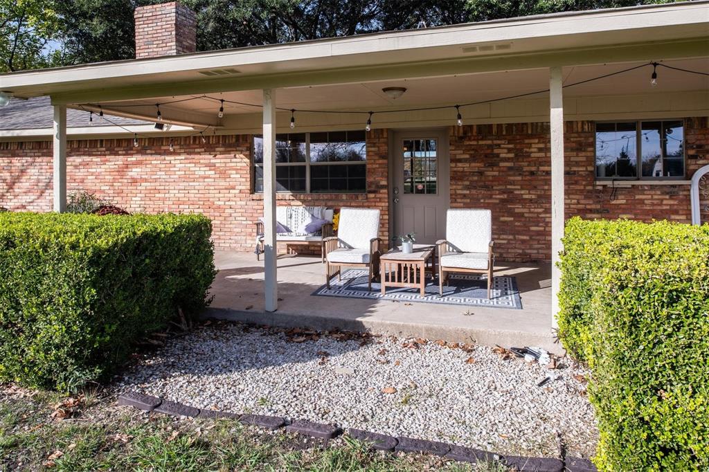 1850 Rock Ridge Road Lucas, TX 75002 - Photo 32 of 34 a view of a patio with table and chairs potted plants