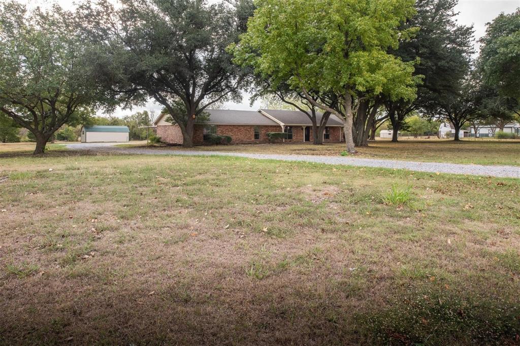 1850 Rock Ridge Road Lucas, TX 75002 - Photo 6 of 34 a front view of house with yard and trees