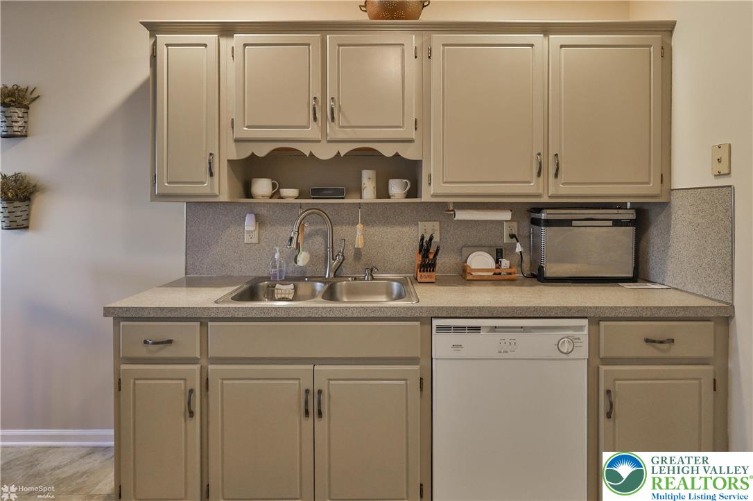 521 South New Street Nazareth, PA 18064 - Photo 11 of 29 a kitchen with white cabinets and a sink
