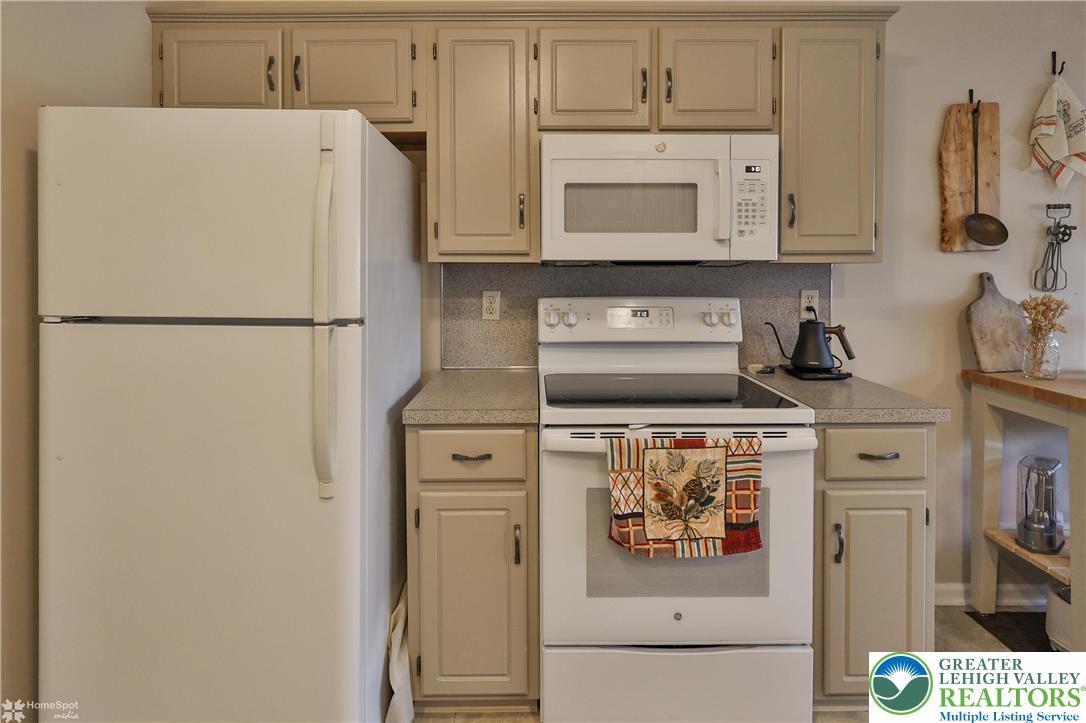 521 South New Street Nazareth, PA 18064 - Photo 12 of 29 a white refrigerator freezer and a stove sitting inside of a kitchen
