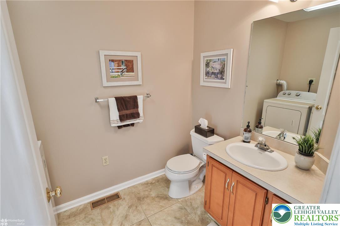 521 South New Street Nazareth, PA 18064 - Photo 14 of 29 a bathroom with a sink toilet and a mirror