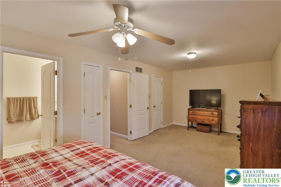 521 South New Street Nazareth, PA 18064 - Photo 18 of 29 a bedroom with furniture and a flat screen tv