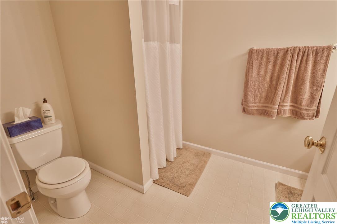 521 South New Street Nazareth, PA 18064 - Photo 19 of 29 a white toilet sitting next to a bathroom sink